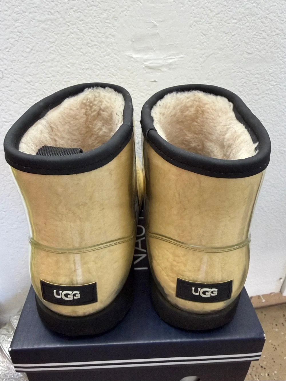 UGG Classic Clear Mini Waterproof Boots in the Natural / Black colorway. Size 6